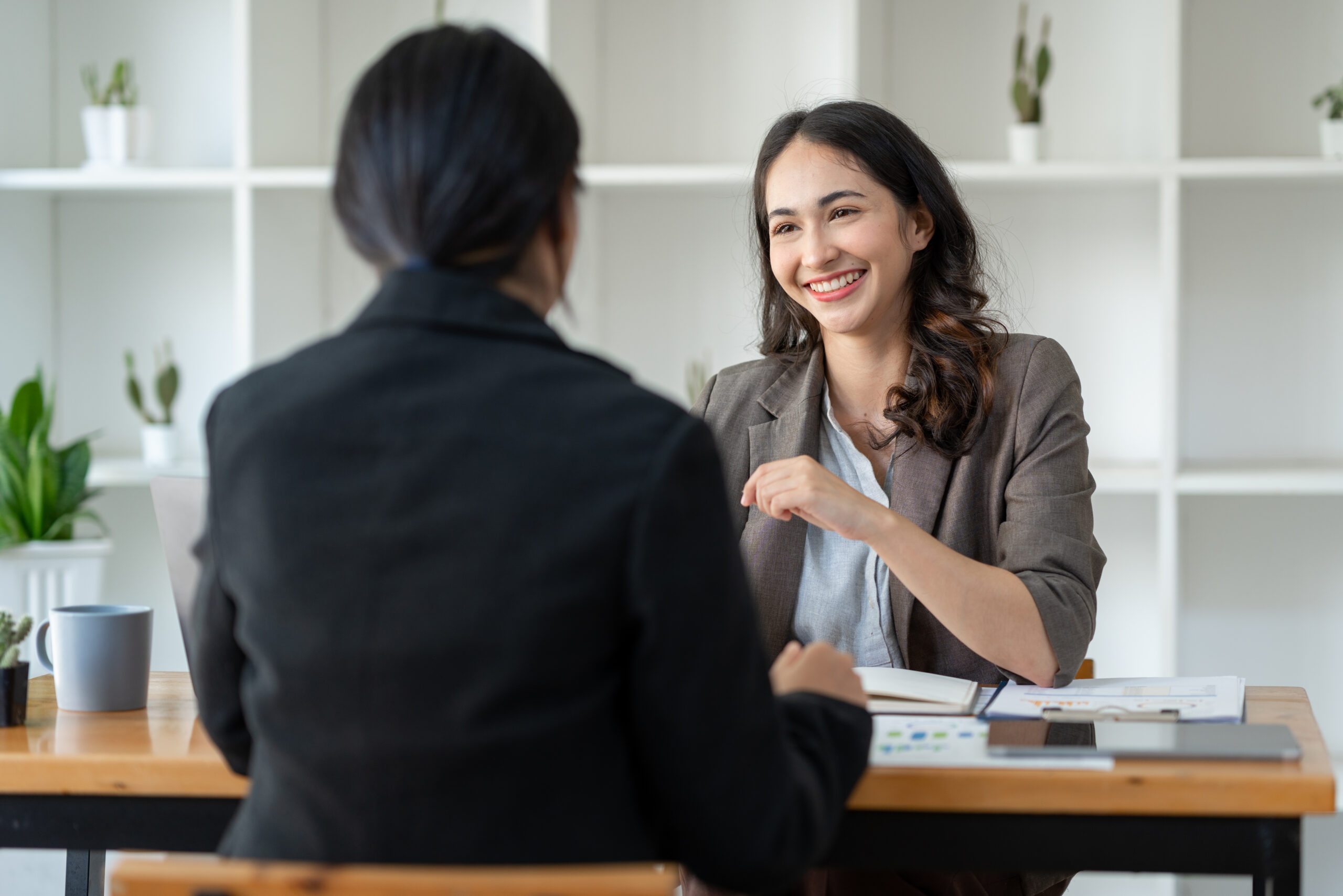 A job applicant talking about her career capital in a job interview.